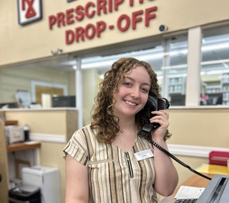 Contact Us photo, Chloe answering phones.